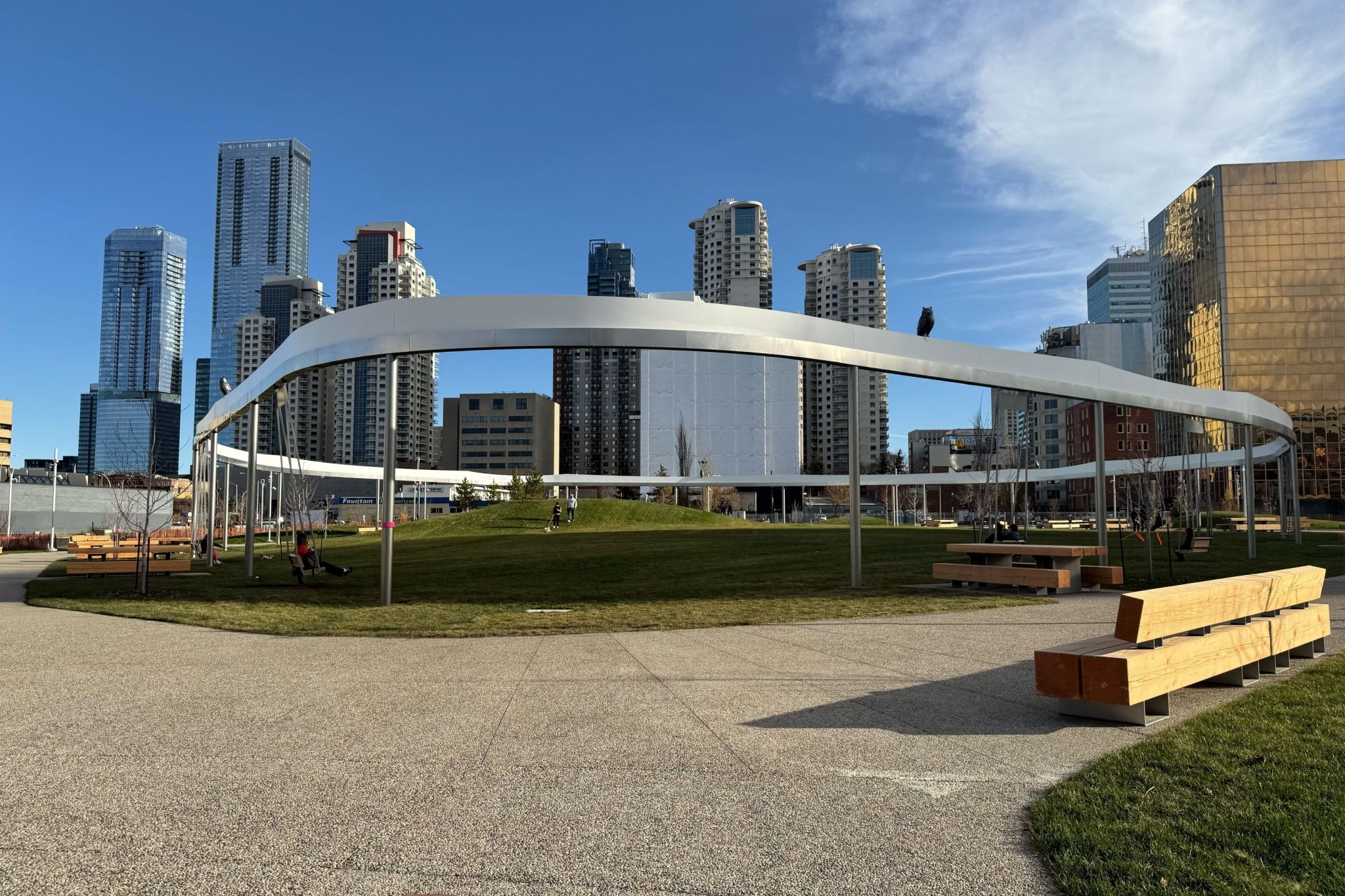 A new downtown Edmonton park has giant swinging benches