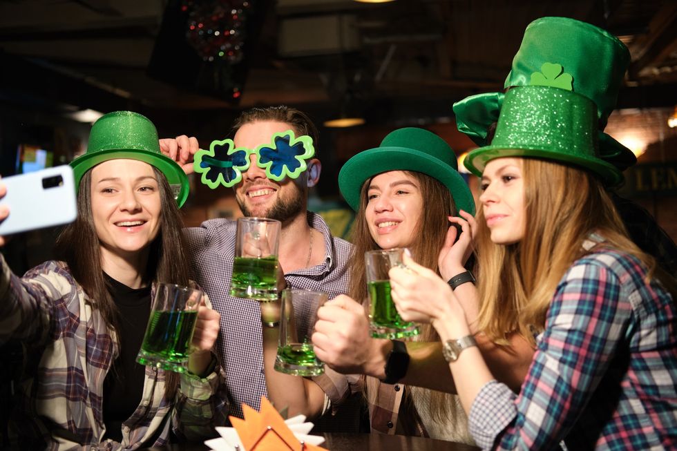 People taking a photo, all dressed up for St. Patrick's Day