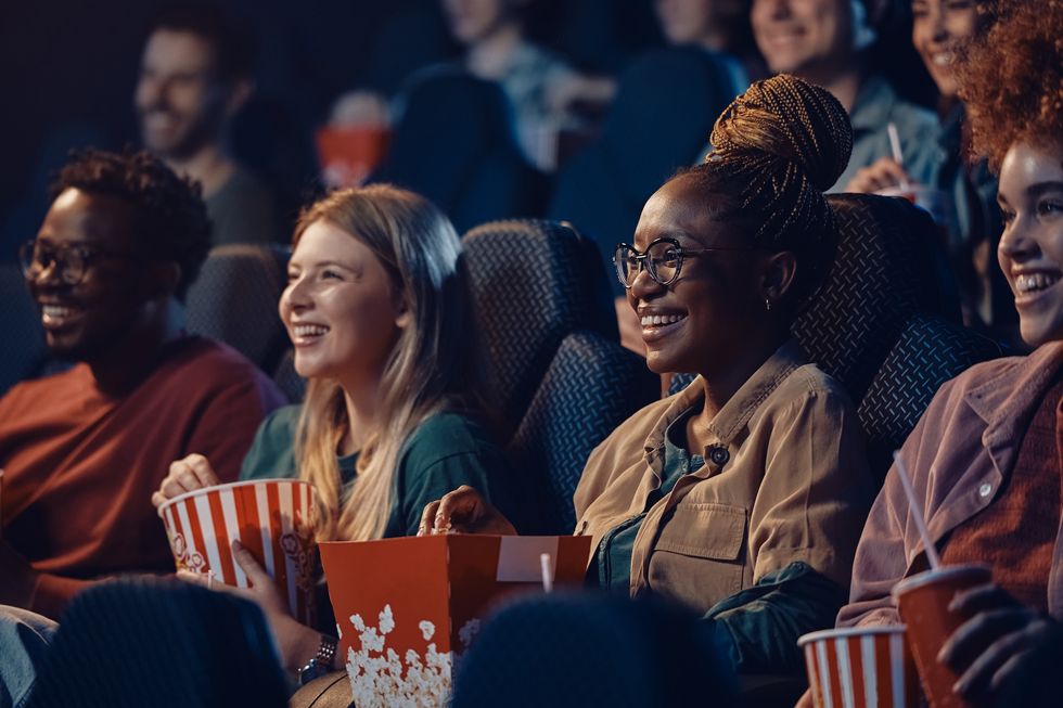 women watching movie at cinema.