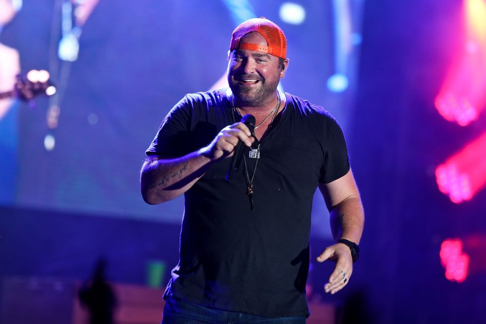 Photo of Lee Brice Lee Brice performing at a concert