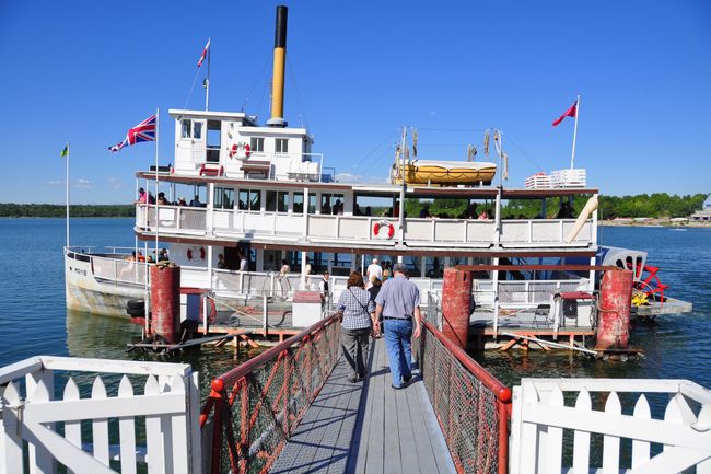 CALGARY, CANADA - AUGUST 6: Tourists boarding Paddle-wheeler at Calgary's living museum 