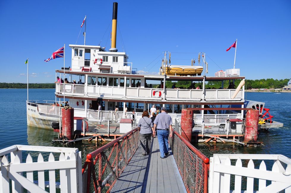 CALGARY, CANADA - AUGUST 6: Tourists boarding Paddle-wheeler at Calgary's living museum 