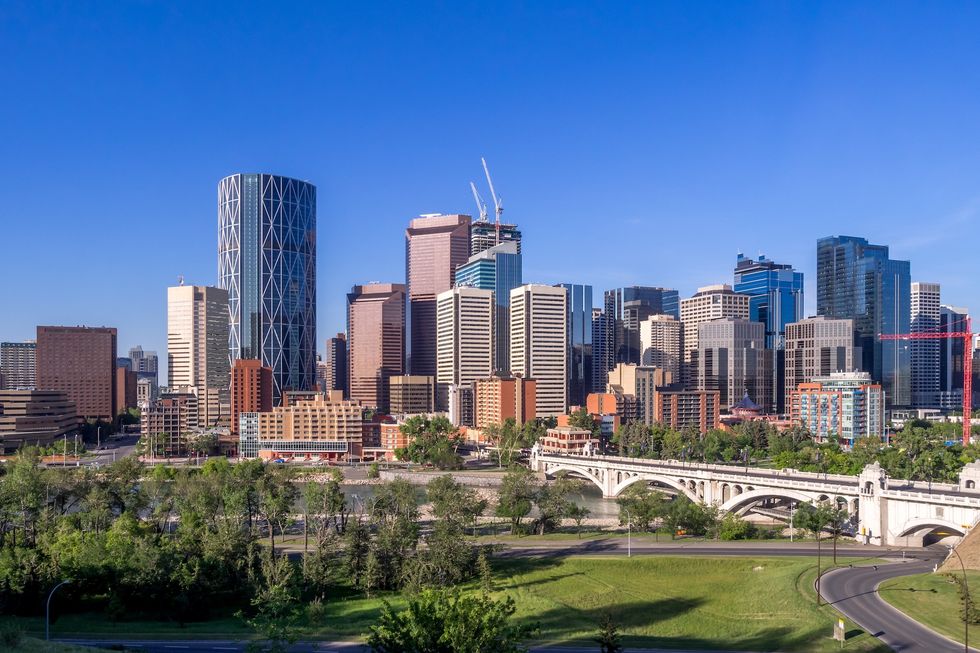 Calgary skyline with Bow River in foreground.