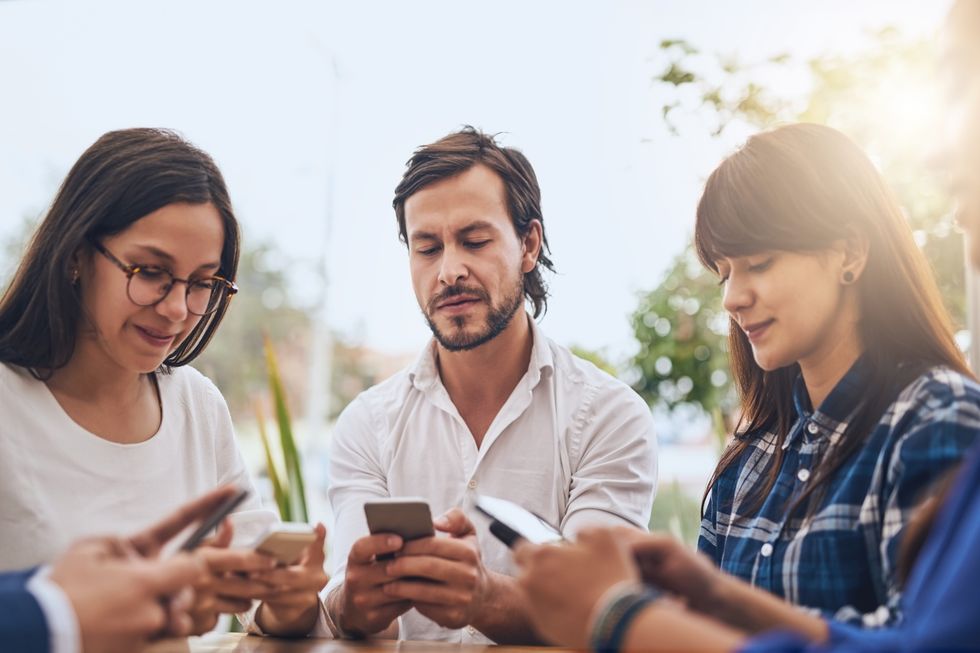 Group of people looking at their phones