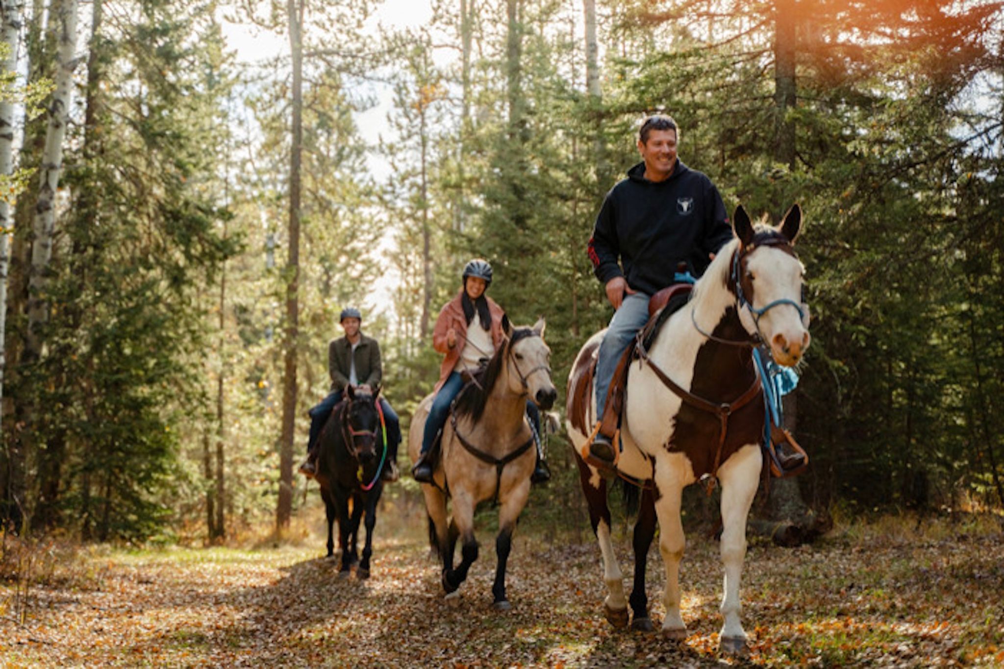 Family horseback riding at Painted Warriors Camp