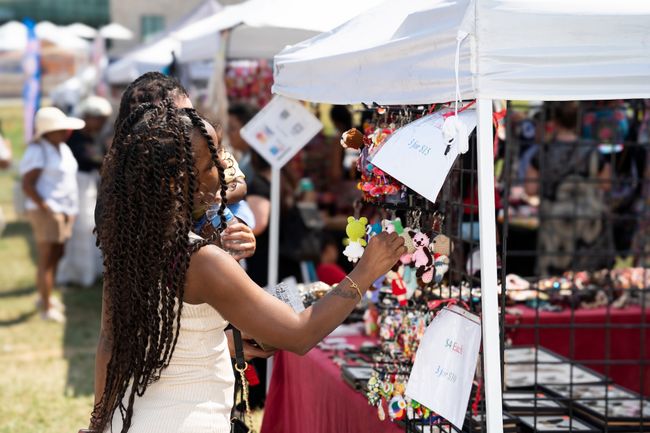 Woman Shopping at Outdoor Craft Market