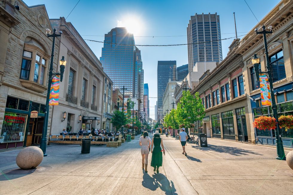 Calgary, Alberta – July 10, 2024: City streets and buildings at sunset. City streets and buildings at sunset.