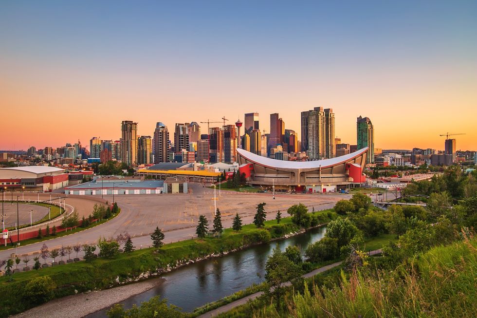 A colorful sunrise sky over downtown Calgary in the summer