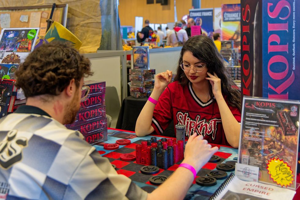 People playing board games at gaming convention