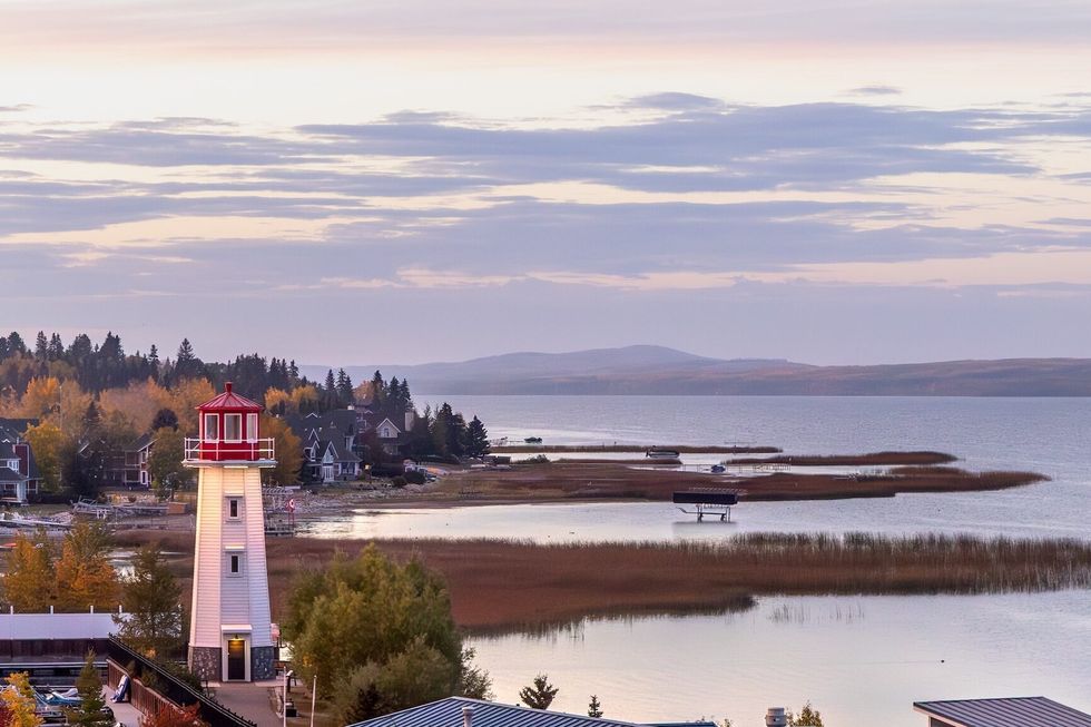 Lighthouse and shoreline at sunset in Sylvan Lake, Alberta, Canada