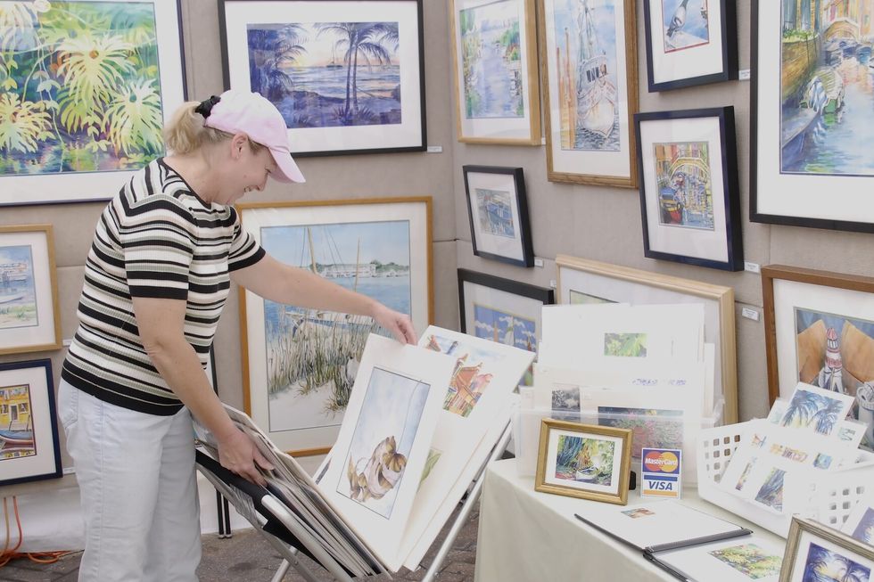 A woman shopping at an art gallery shop