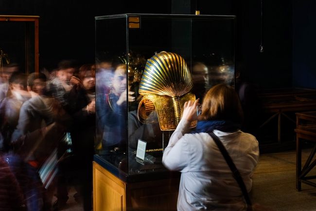 Person looking at King Tut in an exhibit